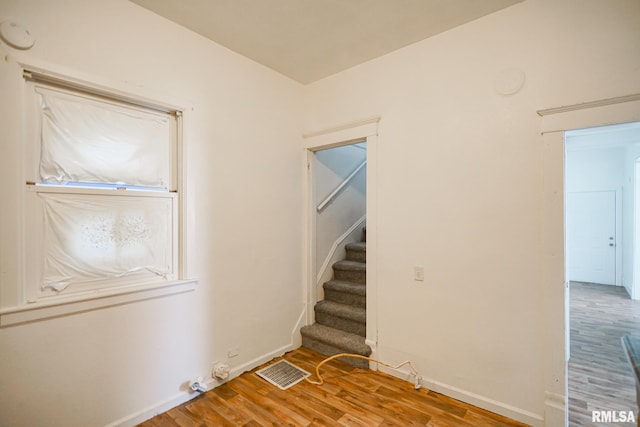 506 Spring St, Peoria, IL 61603 - unfurnished room featuring wood finished floors and stairs