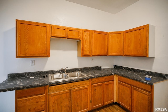 506 Spring St, Peoria, IL 61603 - kitchen with dark wood finished floors and brown cabinets