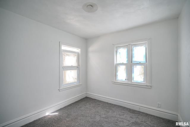 506 Spring St, Peoria, IL 61603 - empty room with carpet floors