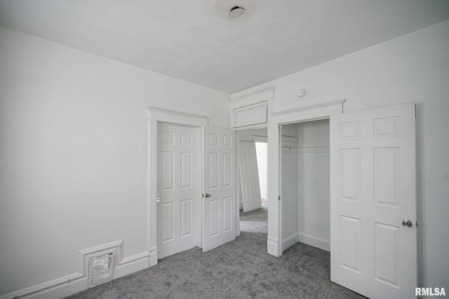 506 Spring St, Peoria, IL 61603 - unfurnished bedroom featuring carpet flooring and a closet