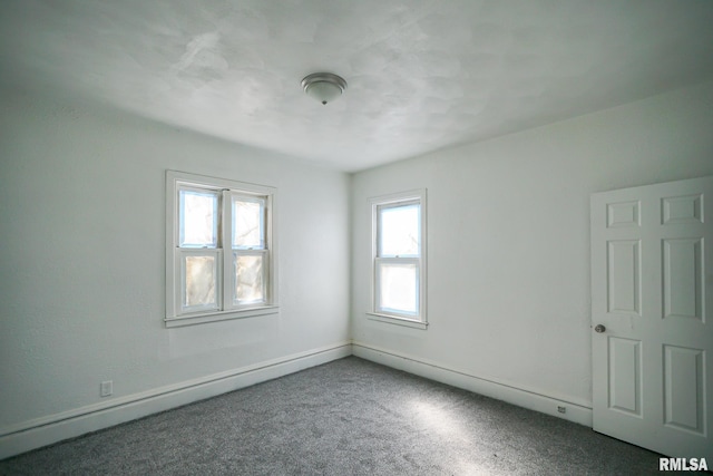 506 Spring St, Peoria, IL 61603 - unfurnished room with plenty of natural light and carpet flooring