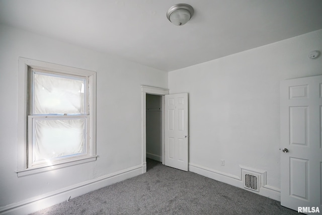 506 Spring St, Peoria, IL 61603 - unfurnished bedroom with carpet flooring and baseboards