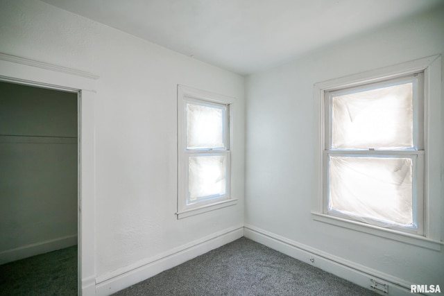 506 Spring St, Peoria, IL 61603 - unfurnished bedroom with carpet floors and baseboards