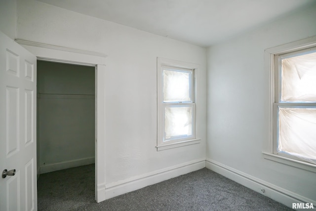 506 Spring St, Peoria, IL 61603 - unfurnished bedroom with carpet floors and a closet