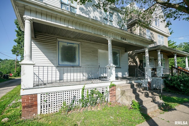 506 Spring St, Peoria, IL 61603 - view of front facade featuring a porch