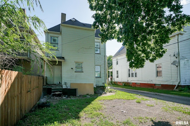 506 Spring St, Peoria, IL 61603 - rear view of house featuring a chimney