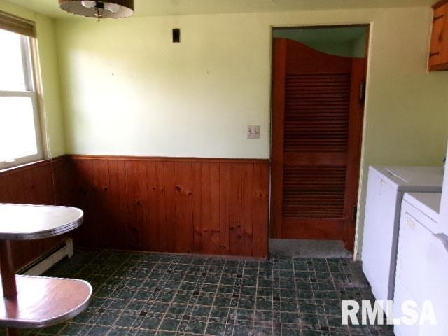 215 N Prairie St, Lacon, IL 61540 - interior space with washer and clothes dryer, a wainscoted wall, and wooden walls