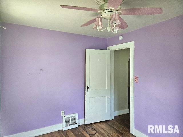 246 E Myrtle St, Canton, IL 61520 - empty room featuring wood finished floors and a ceiling fan