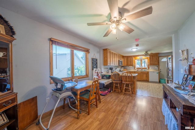 611 E Ash St, Canton, IL 61520 - dining room with ceiling fan, healthy amount of natural light, and light wood-type flooring