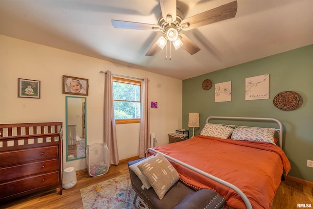 611 E Ash St, Canton, IL 61520 - bedroom featuring wood finished floors and a ceiling fan
