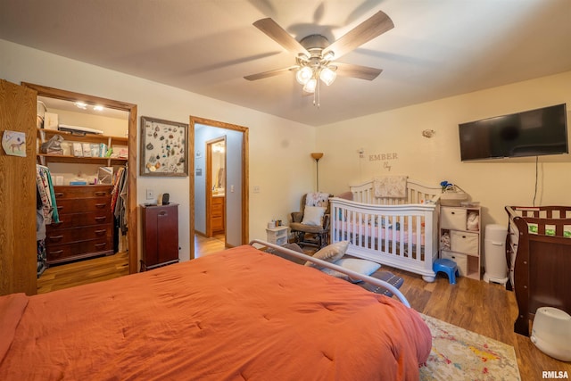 611 E Ash St, Canton, IL 61520 - bedroom with wood finished floors, a ceiling fan, and a closet