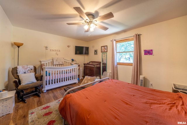 611 E Ash St, Canton, IL 61520 - bedroom featuring wood finished floors and ceiling fan