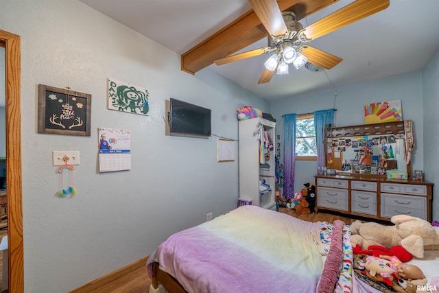 611 E Ash St, Canton, IL 61520 - bedroom featuring wood finished floors, beamed ceiling, and ceiling fan