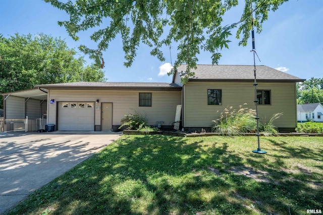 611 E Ash St, Canton, IL 61520 - ranch-style house featuring a carport, a garage, a front lawn, and driveway