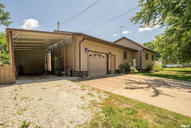 611 E Ash St, Canton, IL 61520 - view of front of property with concrete driveway and a garage
