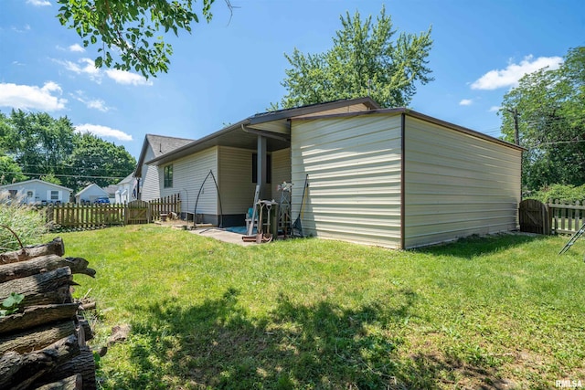 611 E Ash St, Canton, IL 61520 - rear view of property with a fenced backyard