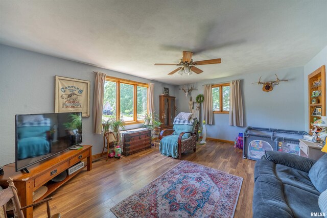 611 E Ash St, Canton, IL 61520 - living area featuring a ceiling fan and wood finished floors