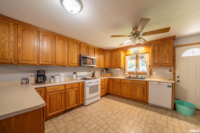 611 E Ash St, Canton, IL 61520 - kitchen with white appliances and brown cabinets