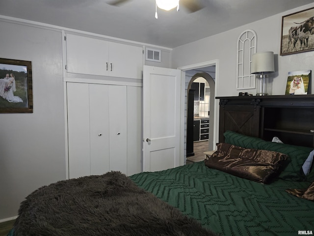270 Thompson Ct, Canton, IL 61520 - bedroom featuring arched walkways, a closet, and ceiling fan