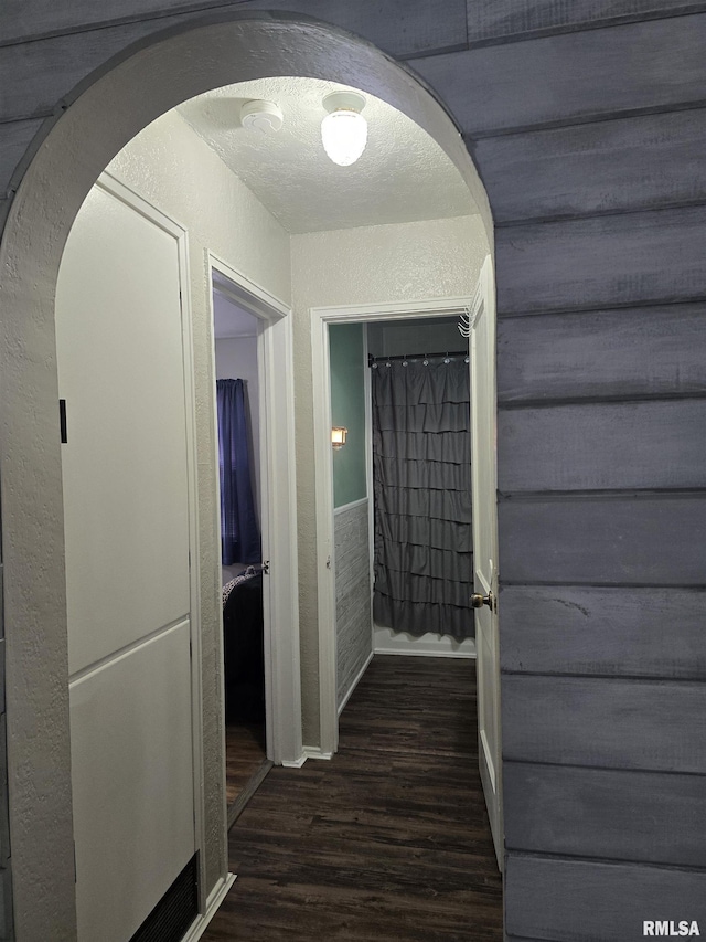 270 Thompson Ct, Canton, IL 61520 - hall featuring wood finished floors, arched walkways, and a textured wall