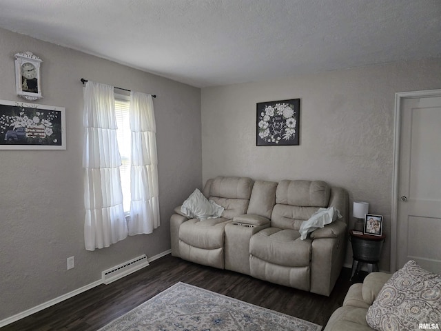 270 Thompson Ct, Canton, IL 61520 - living room with dark wood finished floors and a baseboard heating unit