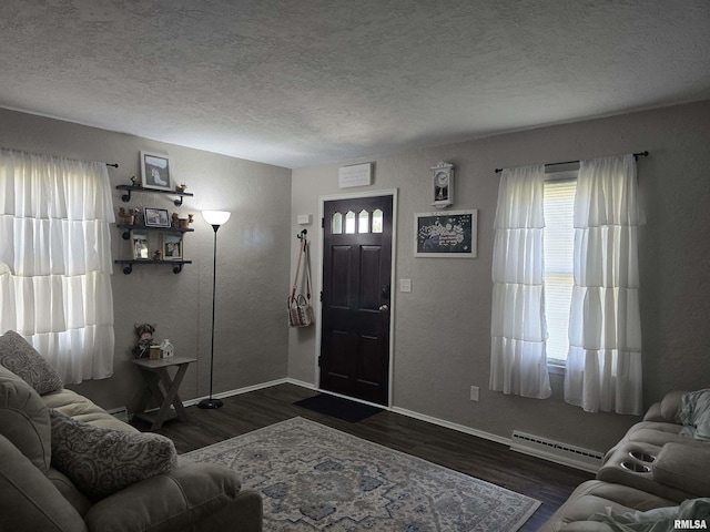 270 Thompson Ct, Canton, IL 61520 - living room with a textured ceiling, a textured wall, dark wood-style flooring, and a baseboard radiator