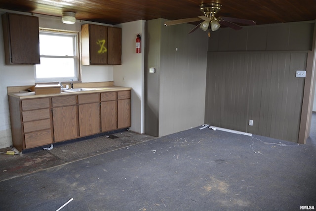 926 N Charles St, Macomb, IL 61455 - kitchen featuring wooden ceiling, ceiling fan, and light countertops