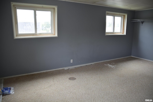 926 N Charles St, Macomb, IL 61455 - unfurnished bedroom featuring carpet floors and a closet