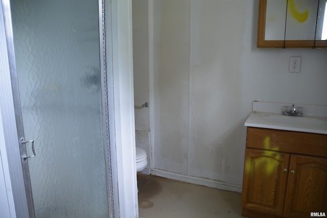 926 N Charles St, Macomb, IL 61455 - full bath with vanity, a shower stall, and concrete floors