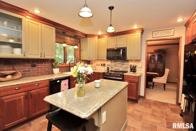 1402 W Grandridge Dr, Dunlap, IL 61525 - kitchen with black appliances, decorative light fixtures, tasteful backsplash, a kitchen breakfast bar, and a kitchen island