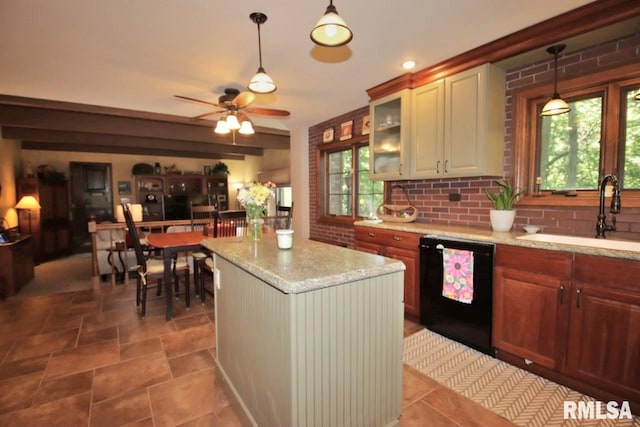 1402 W Grandridge Dr, Dunlap, IL 61525 - kitchen with black dishwasher, a ceiling fan, decorative light fixtures, and light stone countertops