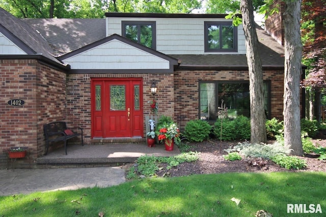 1402 W Grandridge Dr, Dunlap, IL 61525 - entrance to property with brick siding and roof with shingles