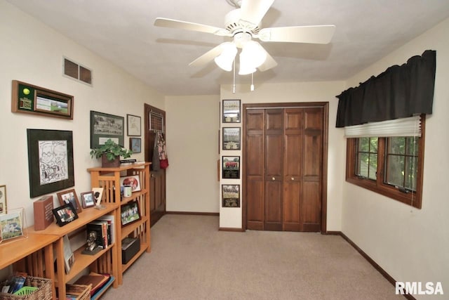 1402 W Grandridge Dr, Dunlap, IL 61525 - bedroom with light colored carpet, a closet, and a ceiling fan