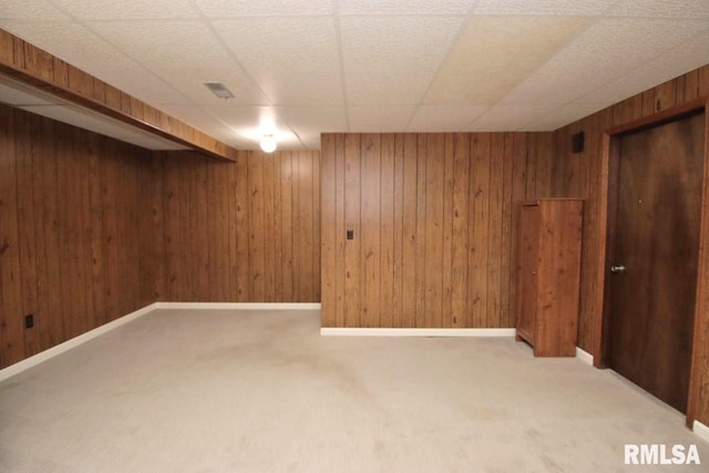 1402 W Grandridge Dr, Dunlap, IL 61525 - finished below grade area featuring carpet flooring, wood walls, and a drop ceiling