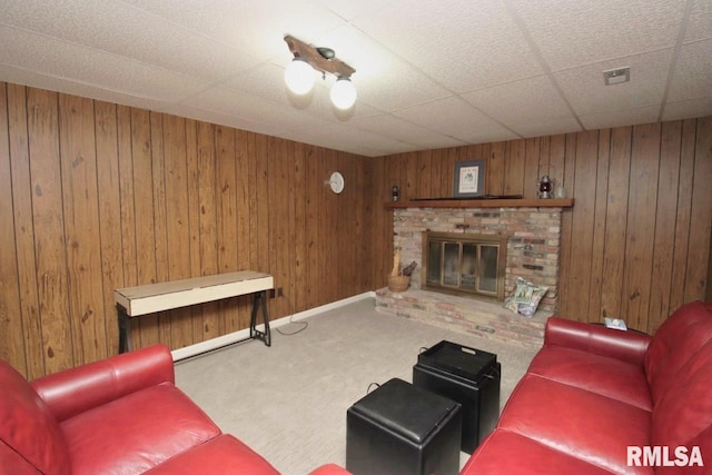 1402 W Grandridge Dr, Dunlap, IL 61525 - carpeted living room featuring a brick fireplace and wooden walls