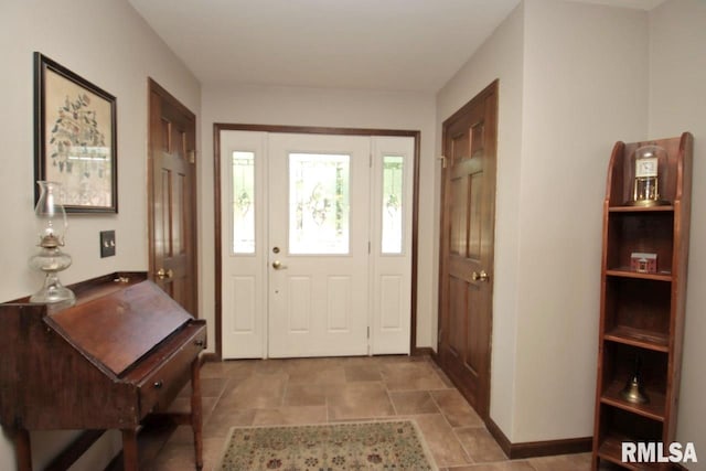 1402 W Grandridge Dr, Dunlap, IL 61525 - entrance foyer with baseboards and stone finish floors