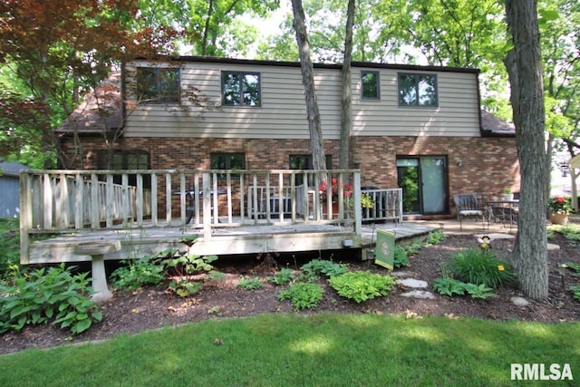 1402 W Grandridge Dr, Dunlap, IL 61525 - back of house featuring brick siding and a deck