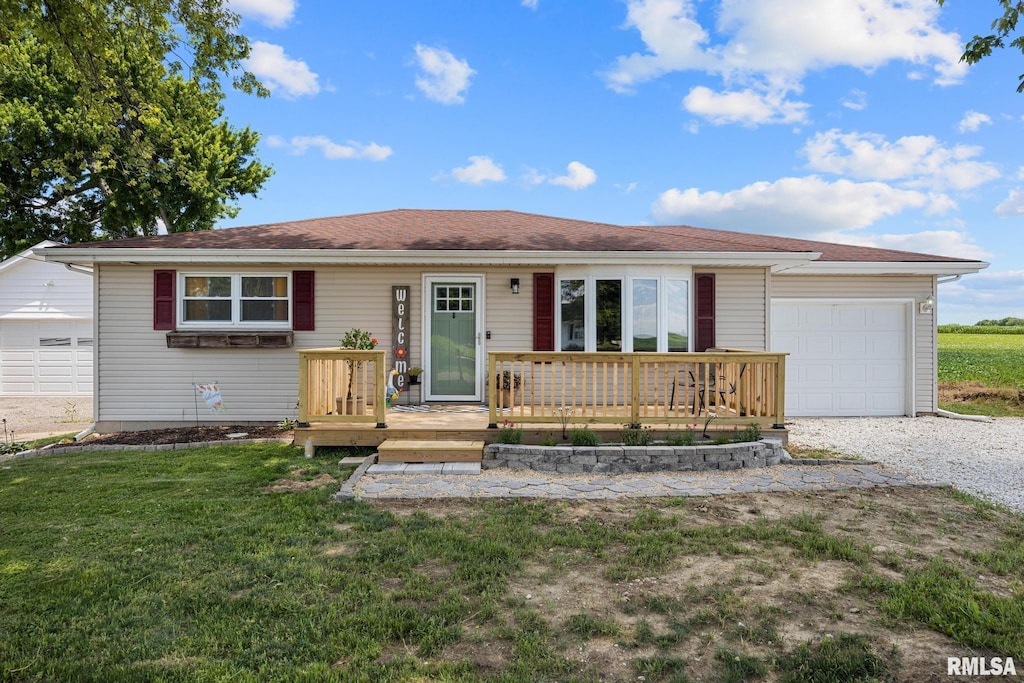 216 Robert St, East Peoria, IL 61611 - ranch-style house with an attached garage, a front yard, and gravel driveway