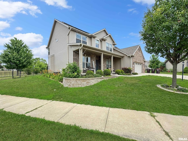 11030 N Ruby Ct, Dunlap, IL 61525 - view of front facade featuring a porch, concrete driveway, an attached garage, and brick siding