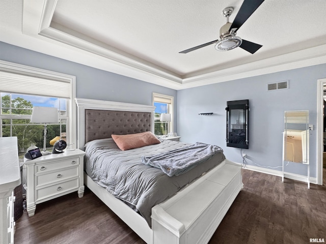 11030 N Ruby Ct, Dunlap, IL 61525 - bedroom featuring a tray ceiling, wood finished floors, and a ceiling fan