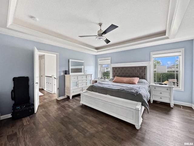 11030 N Ruby Ct, Dunlap, IL 61525 - bedroom featuring a raised ceiling, dark wood finished floors, a textured ceiling, and ceiling fan