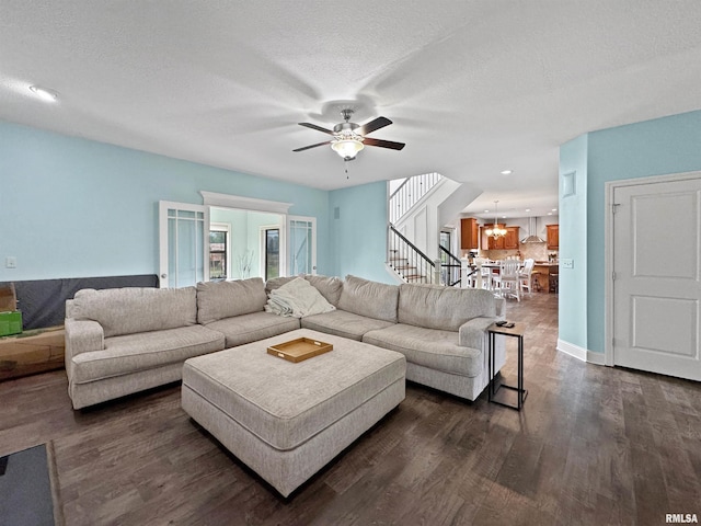 11030 N Ruby Ct, Dunlap, IL 61525 - living room featuring a ceiling fan, dark wood finished floors, stairway, a chandelier, and recessed lighting