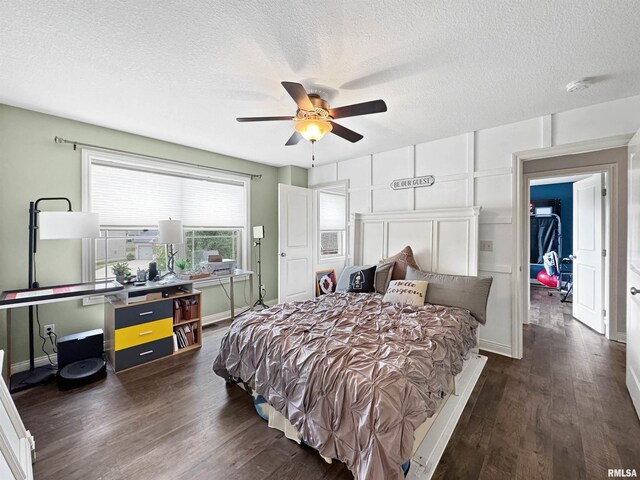 11030 N Ruby Ct, Dunlap, IL 61525 - bedroom featuring wood finished floors, a ceiling fan, a textured ceiling, and ensuite bathroom