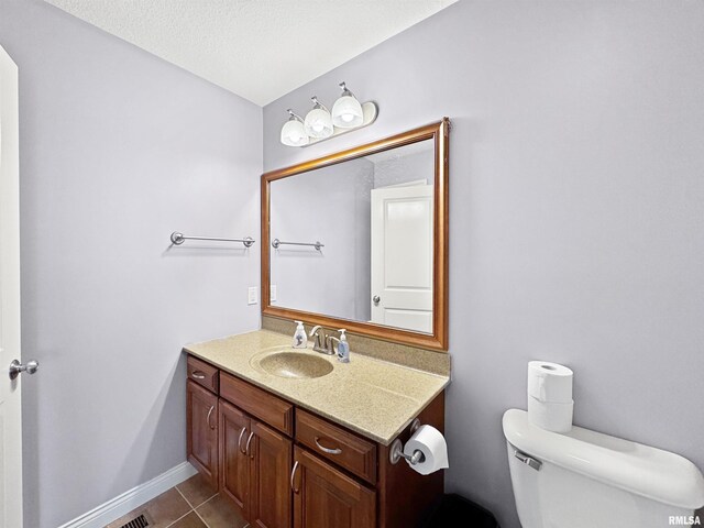 11030 N Ruby Ct, Dunlap, IL 61525 - bedroom featuring dark wood finished floors, an office area, a ceiling fan, and connected bathroom