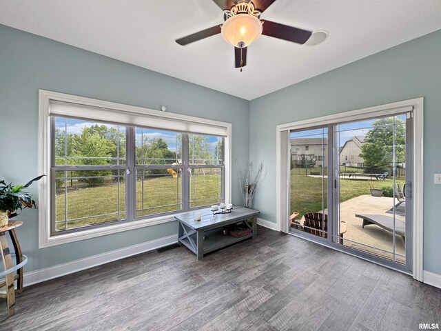 11030 N Ruby Ct, Dunlap, IL 61525 - living area with wood finished floors, ceiling fan, and plenty of natural light