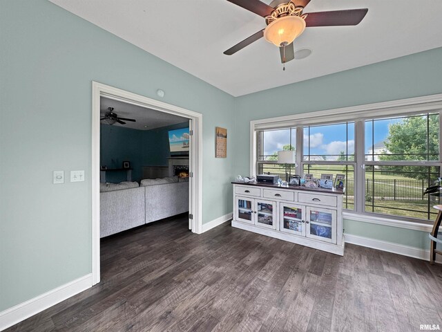 11030 N Ruby Ct, Dunlap, IL 61525 - living room featuring a ceiling fan and dark wood-style flooring