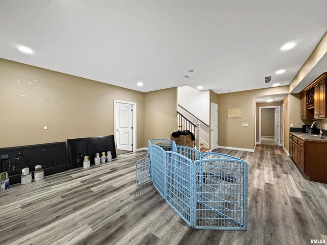 11030 N Ruby Ct, Dunlap, IL 61525 - living room with light wood-style floors, stairs, and recessed lighting