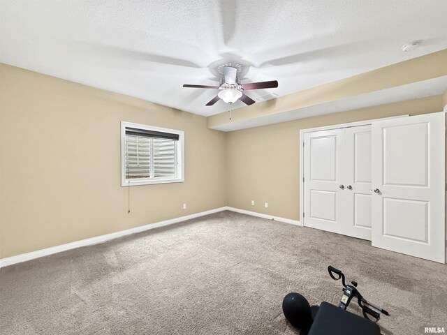 11030 N Ruby Ct, Dunlap, IL 61525 - unfurnished bedroom featuring carpet, a textured ceiling, a closet, and ceiling fan
