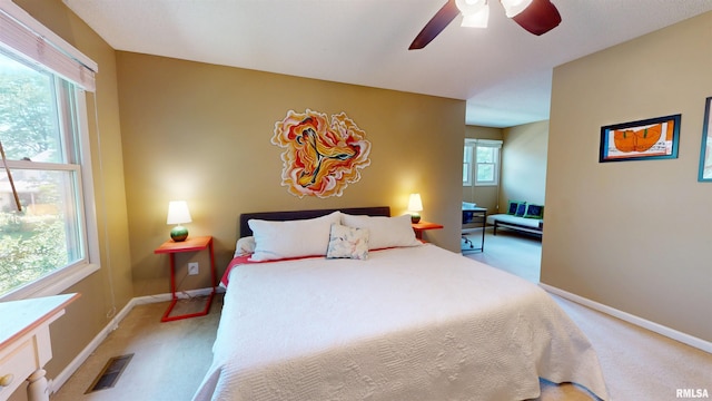 1119 W Brookforest Dr, Peoria, IL 61615 - bedroom featuring light colored carpet and a ceiling fan