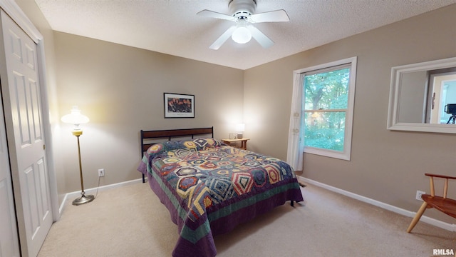 1119 W Brookforest Dr, Peoria, IL 61615 - bedroom featuring light colored carpet, a textured ceiling, and a ceiling fan